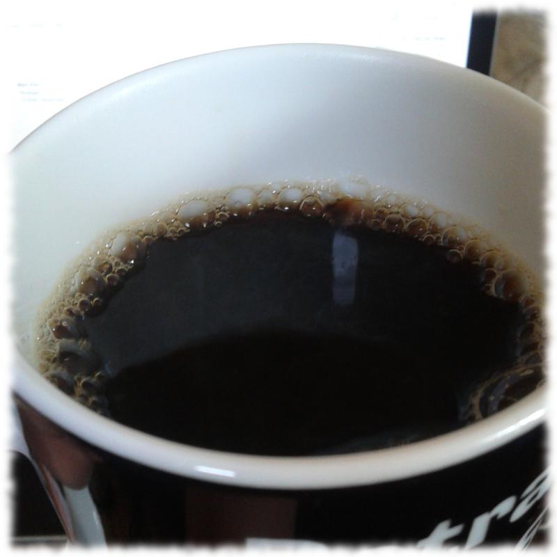 Tasse mit Kaffee drin.